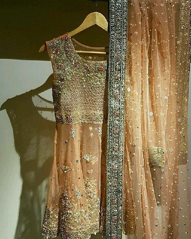 Beautiful bridal dress in peach color with heavy dabka work Model # B 12014